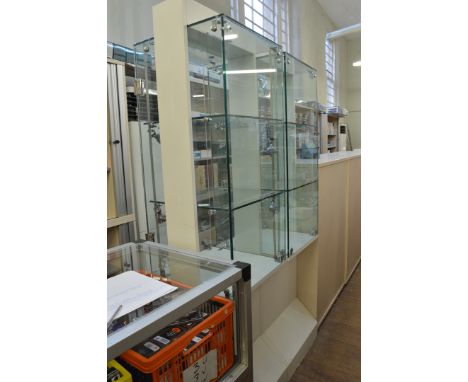 Two display cabinets, having two shelf interior to top section over plinth base, 46cm x 51cm x 181cm high (with keys)