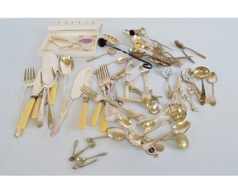 A collection of silver plated flatware,  including a pair of grape shears, two fish servers, two enamel spoons and other item