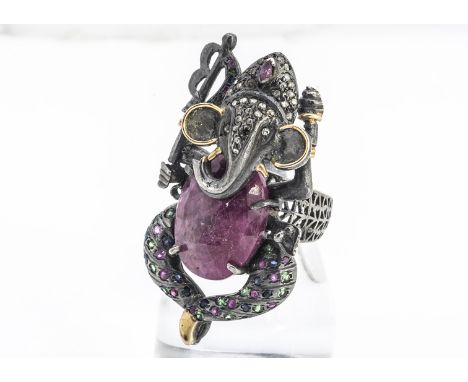 An Indian ruby, emerald, sapphire and diamond dress ring, in the form of the Elephant God Ganesh, heightened with yellow meta