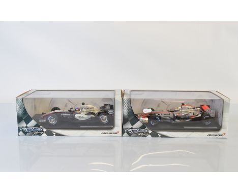 Two Hotwheels Racing McLaren Formula 1 1/18 scale models, McLaren MP4-21 Juan Pablo Montoya and McLaren MP4-20 Juan Pablo Mon