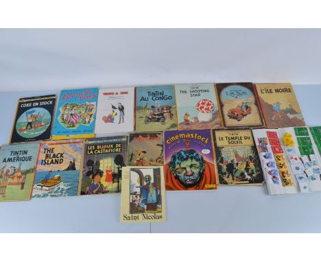 A collection of vintage children's books, including Herge The Adventures of Tintin, Walt Disney Hachette examples. Together w