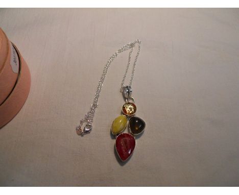 Multi gemstone set silver pendant on silver chain