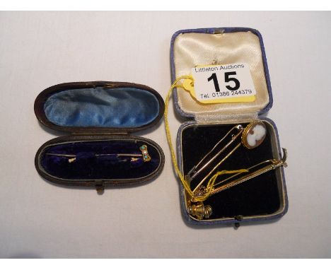 Collection of stick pins and stock pins to include gold