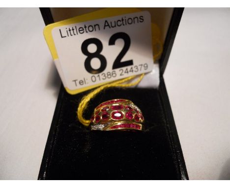 18ct designer ruby and diamond set ring - Estimate £300 to £500 