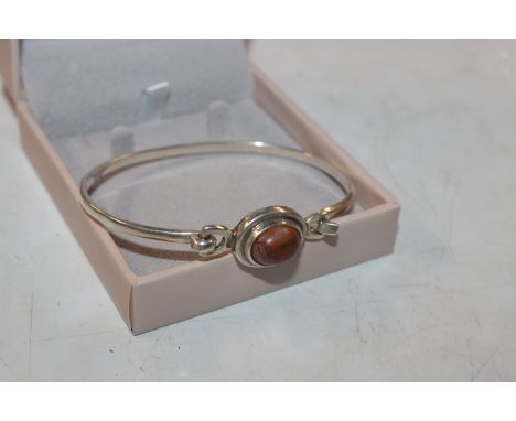 A vintage Sterling silver and amber front opening bangle, approx. 14gms 