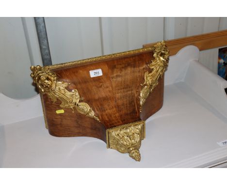 A fruit wood and gilt metal mounted clock bracket, approx. 43cm x 22cm 