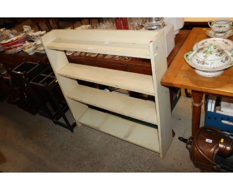 A painted open shelf unit 