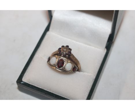 A yellow metal ring set opals and garnets, ring size K/L. approx. 2.5gms total weight; and a 9ct gold garnet cluster ring, ri