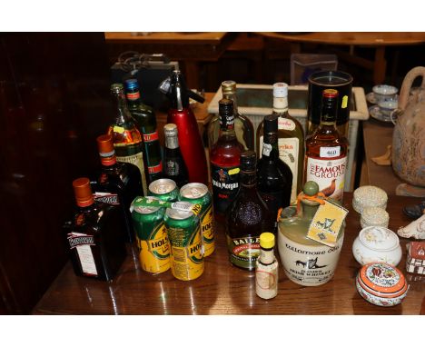 A collection of spirits and liqueur to include Famous Grouse whisky, Captain Morgan rum etc. 