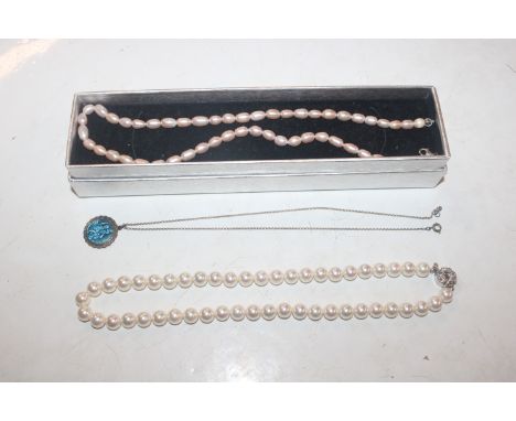 A Sterling silver and enamel decorated pendant hung to fine link chain; and two pearl necklaces