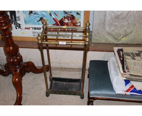 A metal and brass six division stick stand 