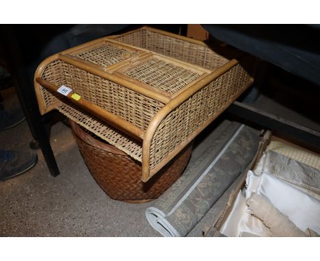 A wicker basket; a wall shelf and small pattern rug 