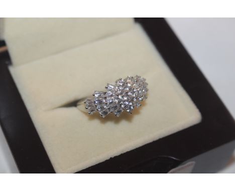 A 9ct white gold ring set with cluster of white stones, ring size M/N, approx. 3.5gms total weight 