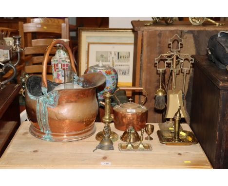 A collection of brass and copper to include coal scuttle, kettle, chamber stick fire irons etc.