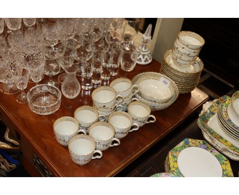 An early 19th Century English porcelain part tea set of fluted design comprising cups, saucers, tea bowls and sugar bowl