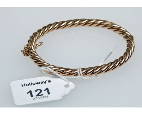 A late Victorian rope twist bangle with concealed push button clasp