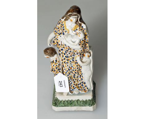 An early 19th century Prattware pottery figure of 'Hope' with children at her feet and infant in arms, raised on a moulded sq