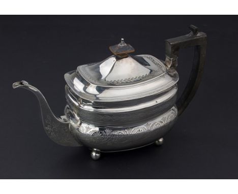 A George III silver teapot, of moulded ogee form, with bright cut decoration and ebonised furniture, London 1810, by Alexande