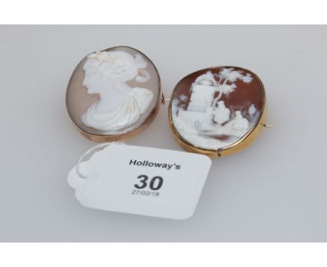 A shell cameo of lady's collecting water, in rural setting, in simple brooch mount, together with another of  a classical fem