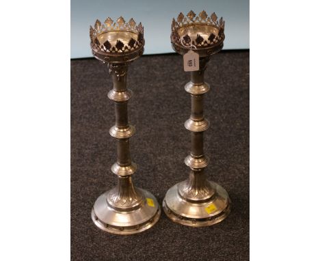 A pair of 20th century white metal altar candlesticks, each with leaf cast rim, knopped engine turned column and stepped circ