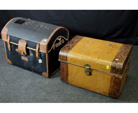An early 20th century dome top cabin trunk with leather bound black fibre body, 69cm wide, together with a grain painted tin 