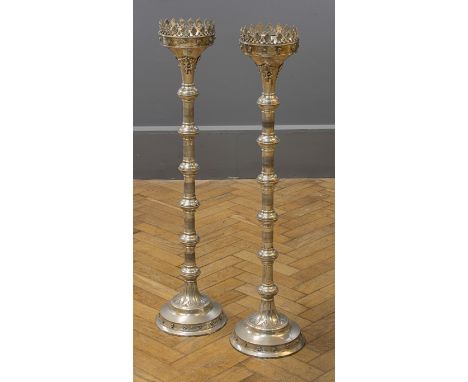 A pair of large 20th century white metal altar candlesticks, each having a leaf cast rim, knopped engine turned column on ste