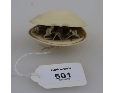 A Japanese Meiji period carved ivory netsuke, 'The Clams Dream', bearing a two character mark to the base, 5.5cm wide