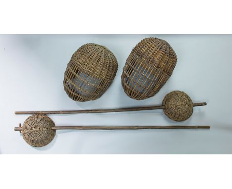 A pair of traditional wicker work and ash 'single stick' fencing helmets and sticks, with cup hilts by Benetfink & Co of Chea