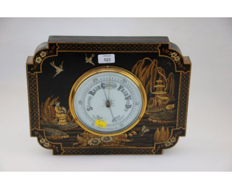 An early 20th century aneroid barometer, in stepped rectangular chinoiserie decorated frame, 29.5 x 37.;5cm