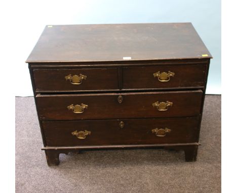 A part George III oak chest, the later rectangular top over two short and two long graduated drawers with brass bastwing drop