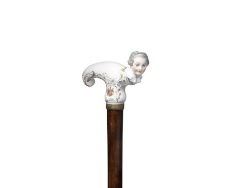 A Meissen figural armorial cane handle, second half 19th centuryScroll-moulded and heightened in gilding, with a female bust 