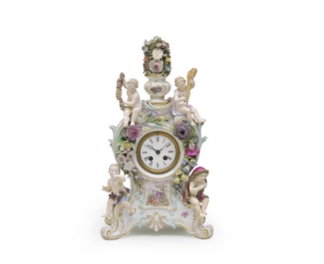 A Meissen clock case, late 19th centuryModelled with scrollwork heightened in puce, gilding and turquoise, applied with four 