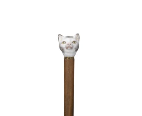 A Continental porcelain cane handle in the shape of a cat's head, 19th centuryNaturalistically modelled and painted in shades