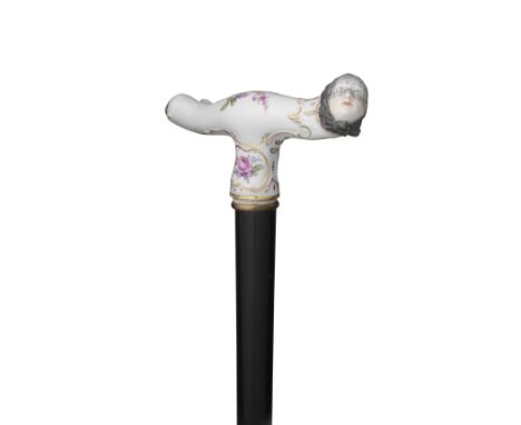 A Meissen figural cane handle, 19th centuryModelled with the head of a woman wearing a headscarf and black lace veil, the res