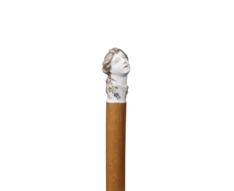 A Chelsea porcelain cane handle, mid 18th centuryModelled by Joseph Willems in the form of a lady's head, turned slightly to 