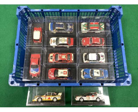 Twelve 1:43rd Scale Diecast Model 'Partworks' Rally Cars to include Audi Quattro, Mitsubishi Lancer Evo, cased.