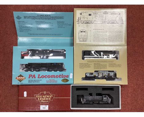 Three boxed HO scale US Diesel locomotives: Proto 2000 PA locomotive in Southern Pacific livery; Proto 2000 GP18 locomotive i