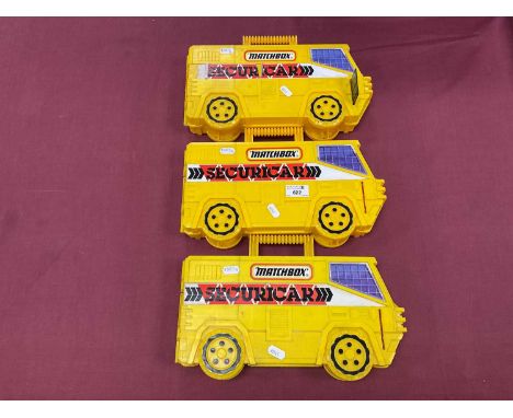 Forty Diecast Model Vehicles by Matchbox, Corgi. Mostly Buses. All presented within Three Matchbox Securicar Plastic Carry Ca