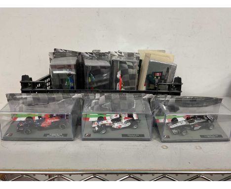 Fourteen 1:43rd Scale 'Panini F1 Collection' Diecast Model Formula One Racing Cars to include McLaren M23 - 1976 James Hunt, 
