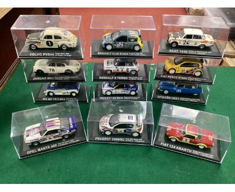 Twelve 1:43rd Scale Diecast Model 'Partworks' Rally Cars to include MG Metro 6R4, Fiat 124 Abarth, cased.