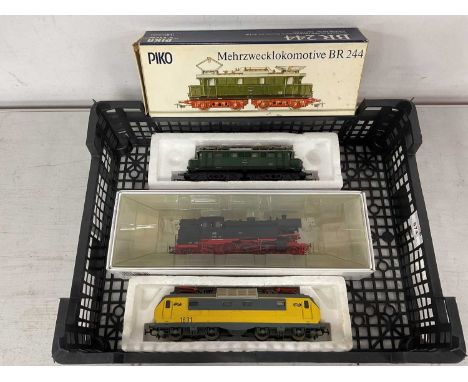 Three European outline HO scale locomotives: a Piko BR244 Bo-Bo electric, a Piko NSB Bo-Bo electric no 1631, and a boxed Lenz