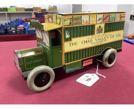 A Post War Clockwork Tinplate 'Games Van' by Chad Valley, complete, overall some slight wear and scratches, however displays 