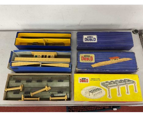 Three boxed Hornby Dublo 00 gauge railway buildings and lineside accessories, including D1 Island Platform set, Engine Shed E
