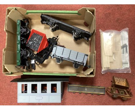 A quantity of G scale rolling stock and parts by LGB and others including a four-wheel coach chassis and body, a flat wagon, 