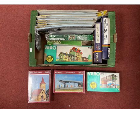 A large quantity of HO scale European themed building kits and scenic items by Pola, Faller, Heljan, and Vero, many in origin
