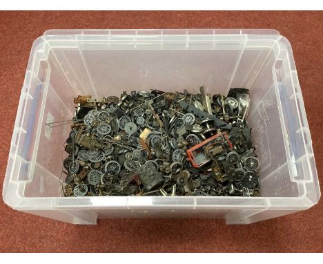 A large quantity (approximately ten litres) of model railway wheels and mechanisms in various scales and sizes.