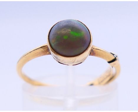 An opal ring. Ring size O/P, opal 7mm diameter.