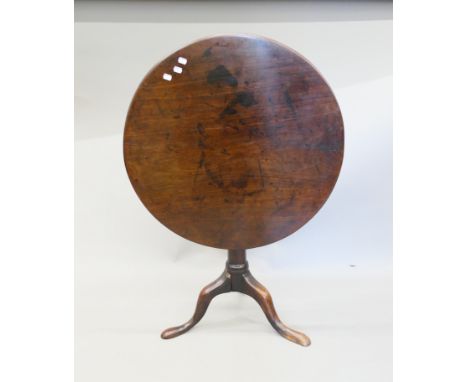 A George III mahogany tilt-top tripod table. 75 cm diameter.