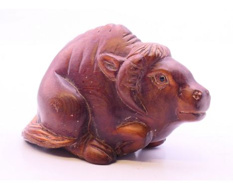 A netsuke in the shape of a buffalo. 6 cm long.