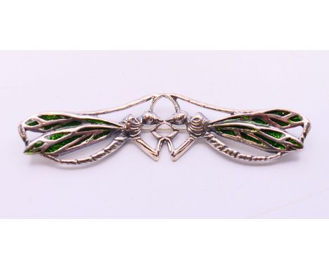 A silver  brooch in the form of two dragonflies.  9 cm x 2.5 cm. 
